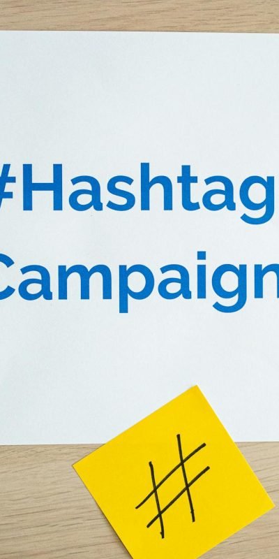 Photo by Walls.io Colorful sticky notes arranged around a hashtag campaign sign, ideal for social media marketing concepts.